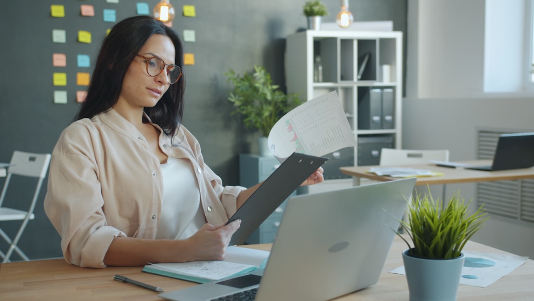 Do Gig Workers Need Insurance in Canada Person reviewing a document at a desk, representing insurance questions for gig workers in Canada