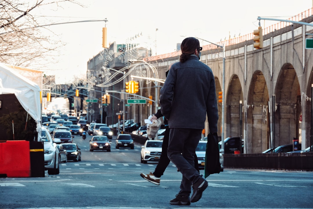 Person walking through a downtown city street, representing the search for job hunting tips in Vancouver