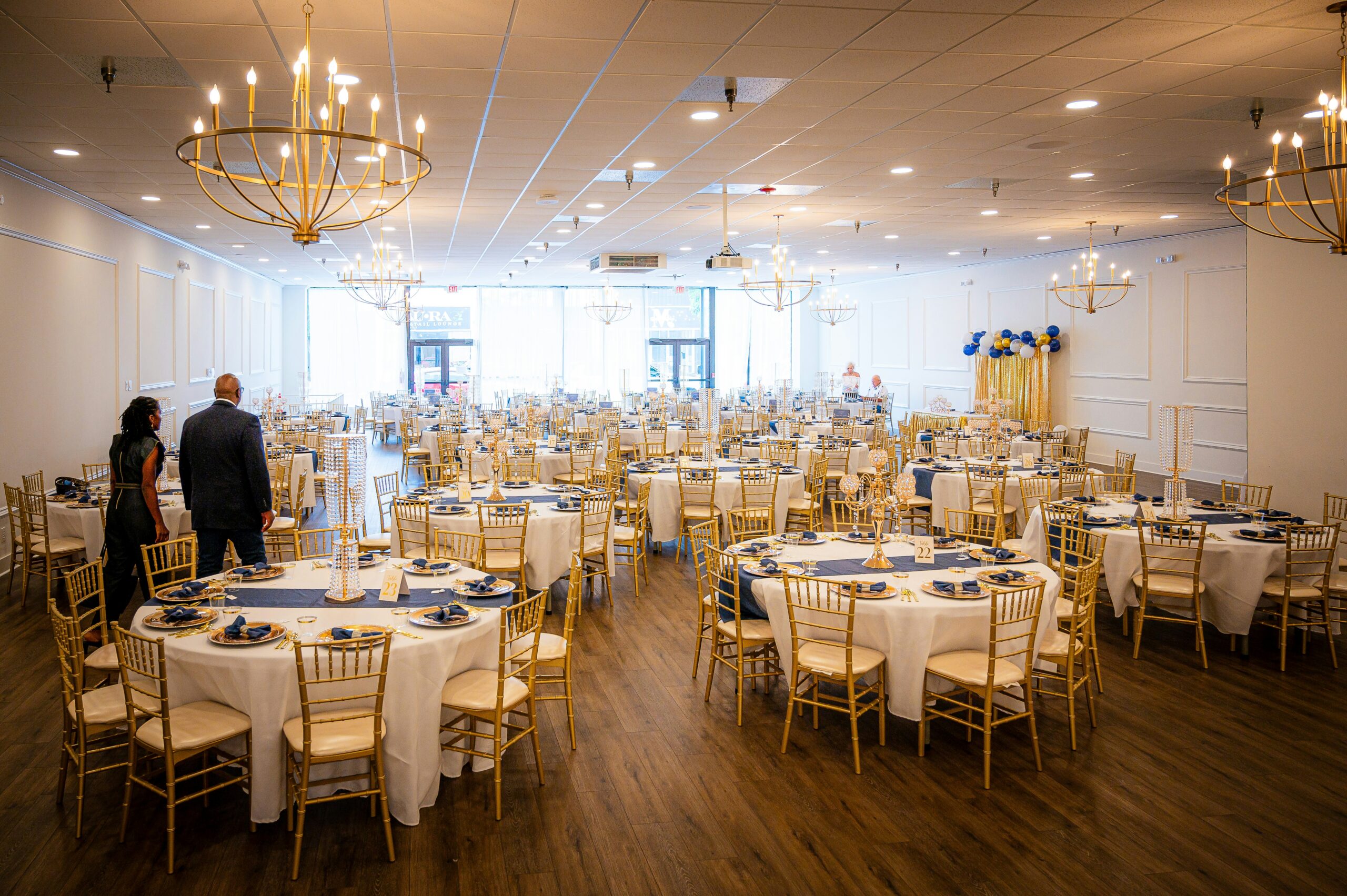 Banquet hall set up with round tables for an event, the kind of last-minute event staffing gap this guide helps job providers fill