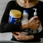 A local service provider gathering cleaning supplies, representing local service providers in Calgary available through Djobzy