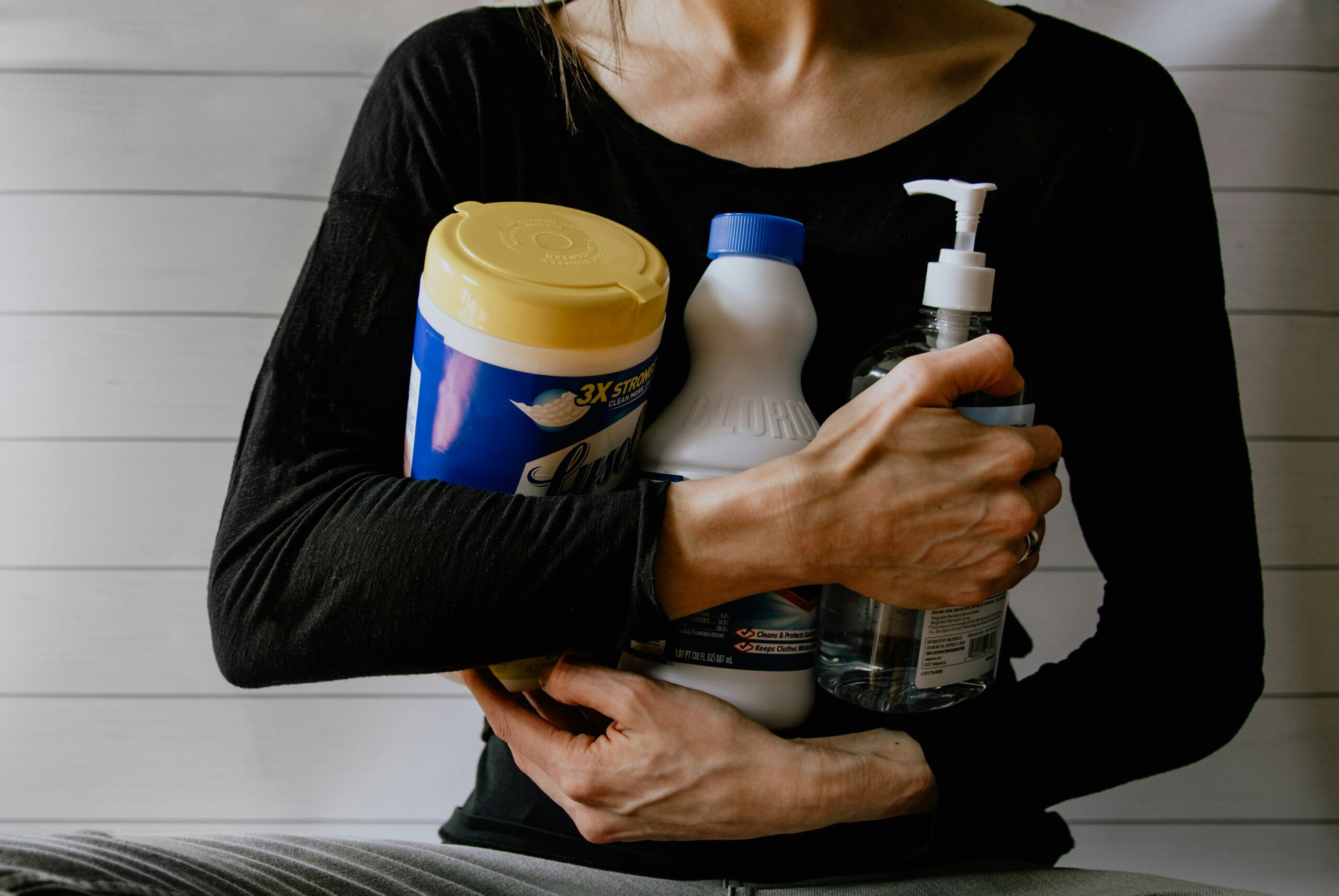 A local service provider gathering cleaning supplies, representing local service providers in Calgary available through Djobzy
