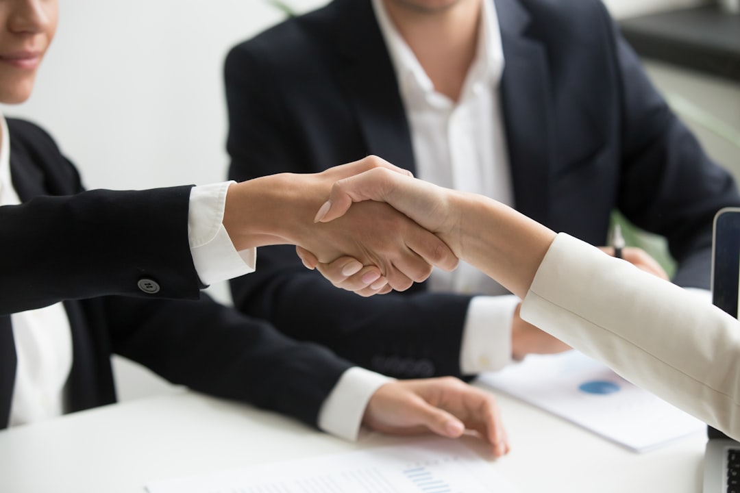 Two people shaking hands after a job interview