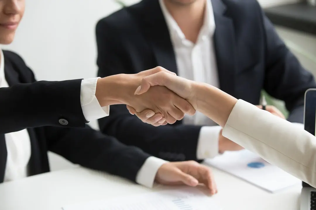 Two people shaking hands after a job interview